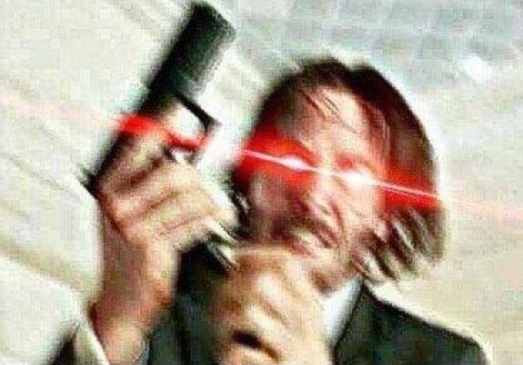 John Wick Reloading a gun meme template