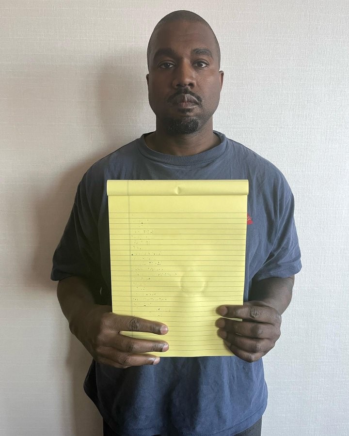 Kanye West Holding A Blank Notepad meme template