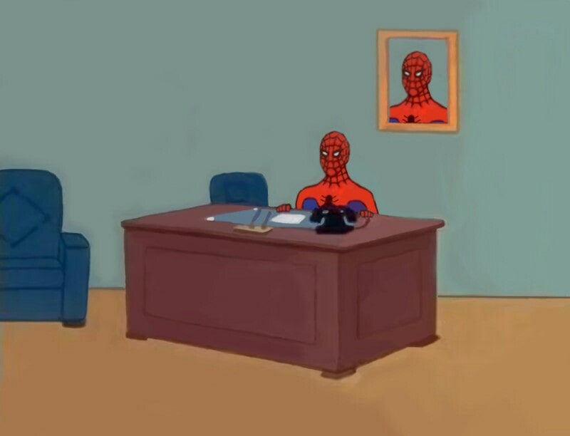 Spider-Man sitting on a desk meme template