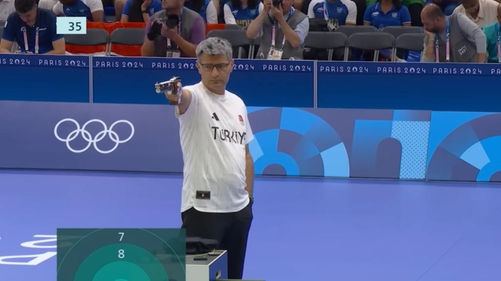 Turkish shooter Yusuf Dikec at olympics taking his shot which turned to be a viral meme