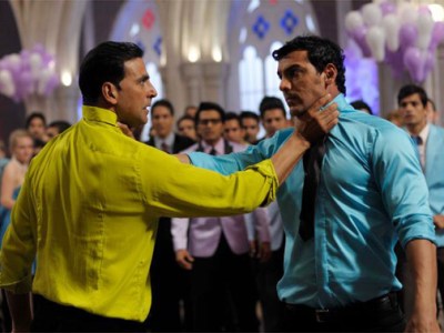 Akshay Kumar and John Abraham both holding one another's necks fighting in housefull 2 movie meme