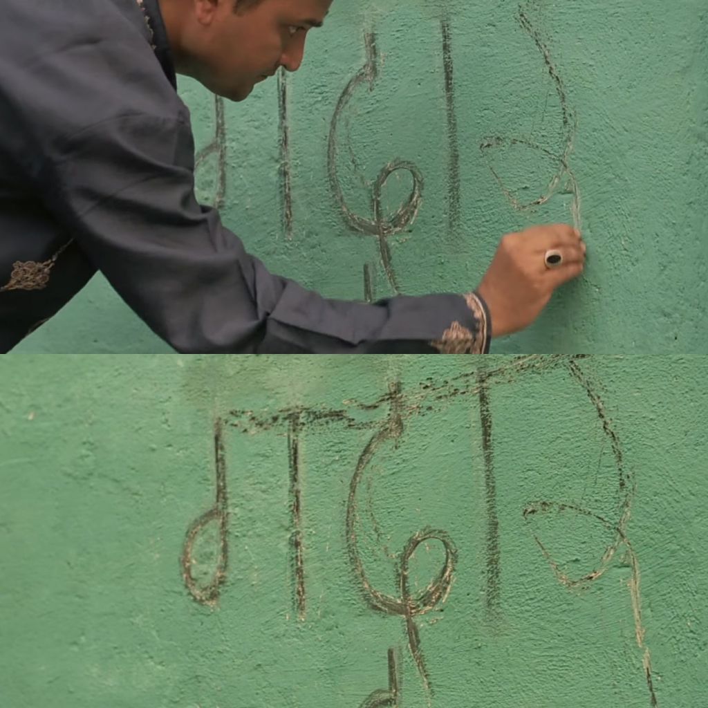 Man writing gaddar in front of Kabir Khan's house chak de India meme