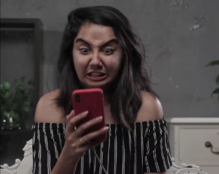 Prajakta Koli a.k.a. mostly sane funny reaction looking at her phone meme