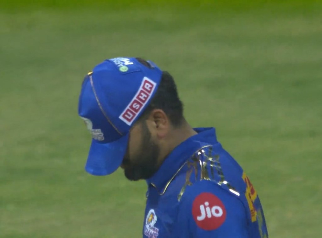 rohit sharma hiding his face with his hat