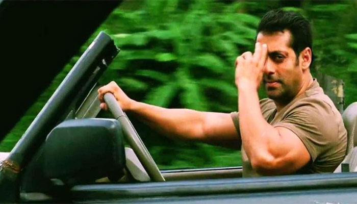 Salman Khan driving a car and showing a bye gesture in tiger zinda hai